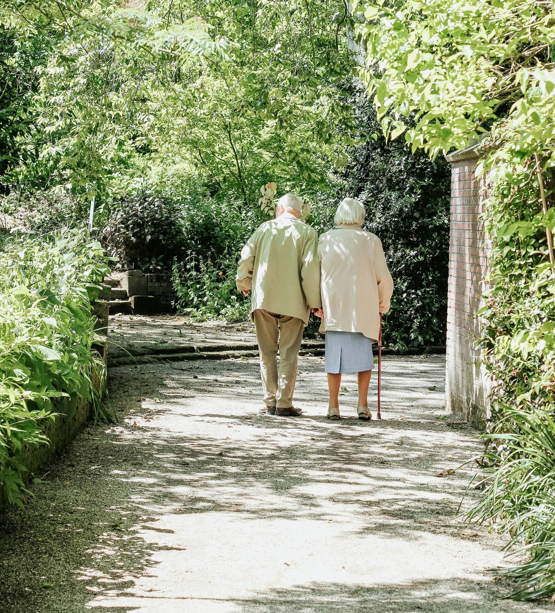 man and woman walking on road during daytime